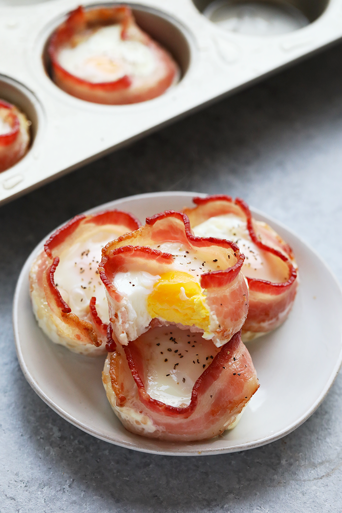 Bacon wrapped egg cups on a plate