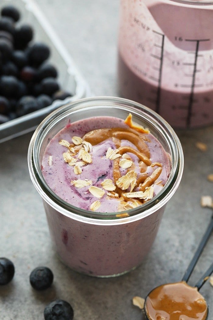 peanut butter and jelly smoothie in glass.