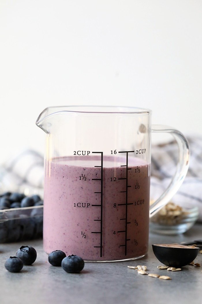 This peanut butter and jelly protein smoothie is a tasty and healthy twist on your favorite childhood classic. Plus it is the perfect post-workout snack packed with protein and deliciousness.