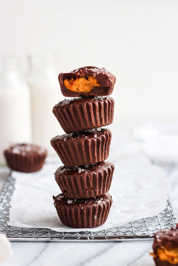 A stack of pumpkin peanut butter cups on a tray.