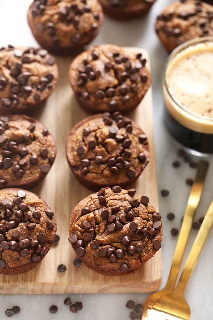 If you're running low on baking ingredients, make these gluten free pumpkin muffins! They are made with 4 ingredients. They are gluten free, delicious, and the perfect fall treat! Gluten Free Pumpkin Muffins on a cutting board