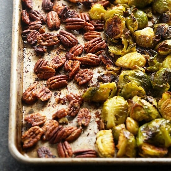 Roasted brussels sprouts and pecans on a baking sheet, perfect recipe.