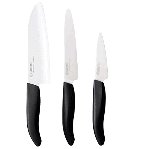 Three kitchen knives with black handles on a white background.