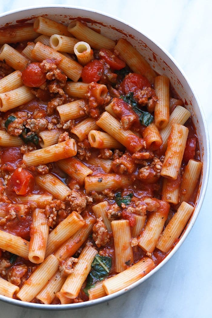 Looking for a pre-race carbo load? You've come to the right place! This Sausage Pizza Pasta is made in just 30-minutes using just 8 simple and healthy ingredients. We've stripped a sausage pizza and turned it into a delicious healthy sausage pizza pasta that's gluten-free friendly! sausage pizza pasta no cheese