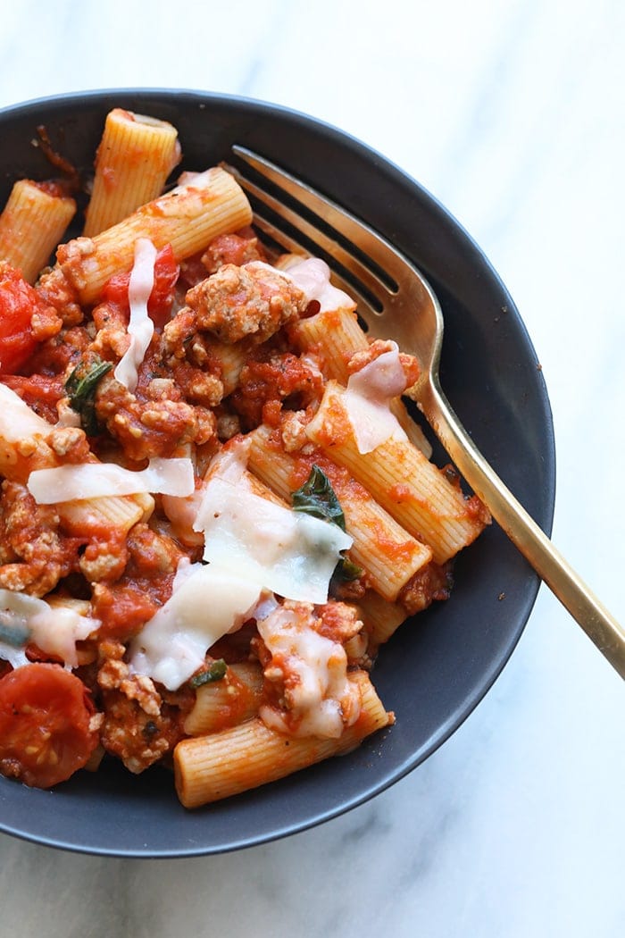Looking for a pre-race carbo load? You've come to the right place! This Sausage Pizza Pasta is made in just 30-minutes using just 8 simple and healthy ingredients. We've stripped a sausage pizza and turned it into a delicious healthy sausage pizza pasta that's gluten-free friendly! up close bowl of pasta
