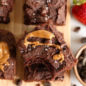 Paleo chocolate peanut butter brownies on a cutting board.