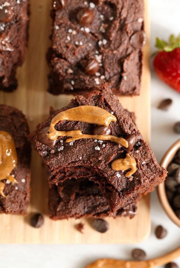 Paleo chocolate peanut butter brownies on a cutting board.