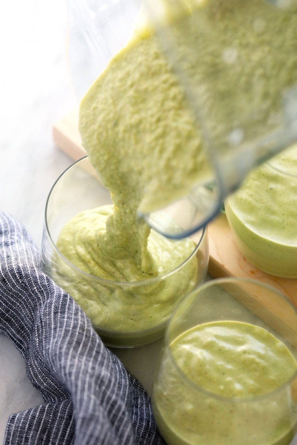 Pouring the smoothie into a glass