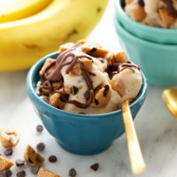 Two bowls of banana nice cream with chocolate chips.