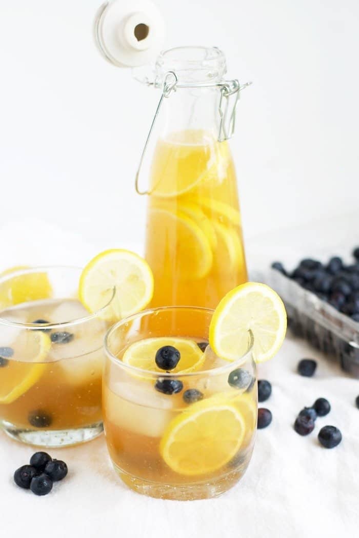 Kombucha Lemonade in two cups and a pitcher