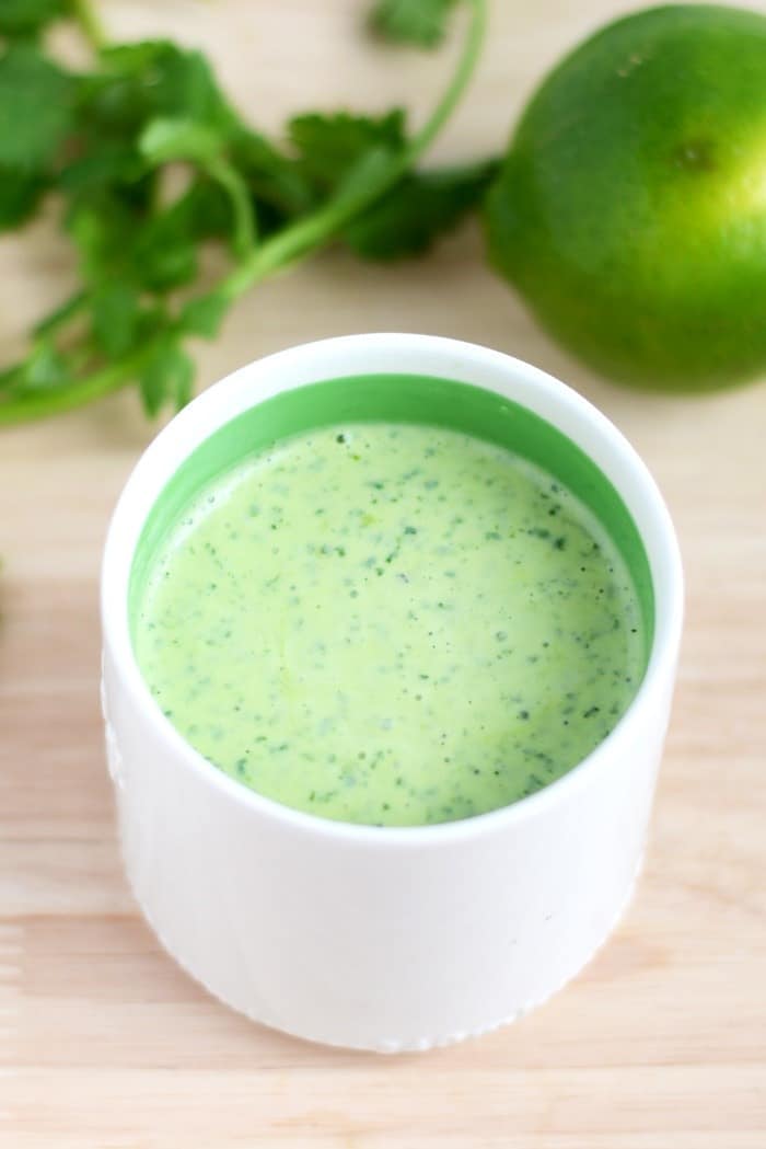 Tangy cilantro dressing in a small dish. 