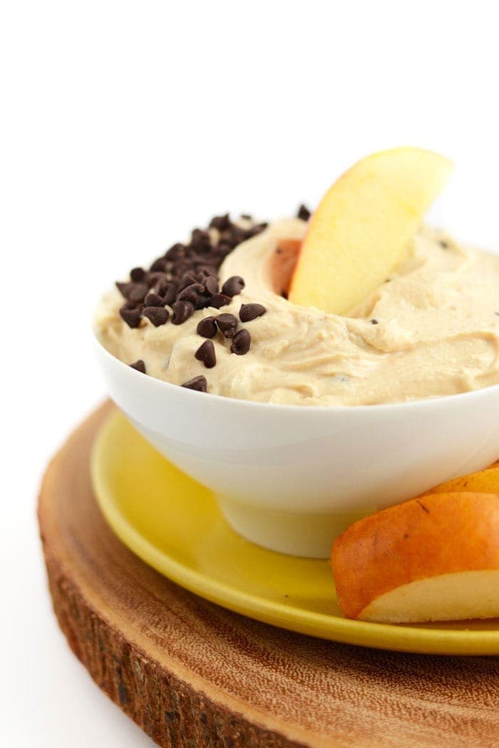 peanut butter greek yogurt dip in a bowl with chocolate chips