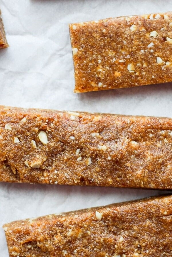 Peanut butter granola bars inspired by Copycat Cashew Cookie Lärabars, served on a piece of paper.