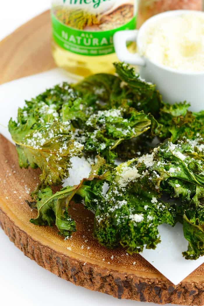 Love the crunch, but not the calories that comes with potato chips? Make these sea salt and vinegar kale chips with a hint of parmesan cheese for the most delicious and healthy snack ever! 
