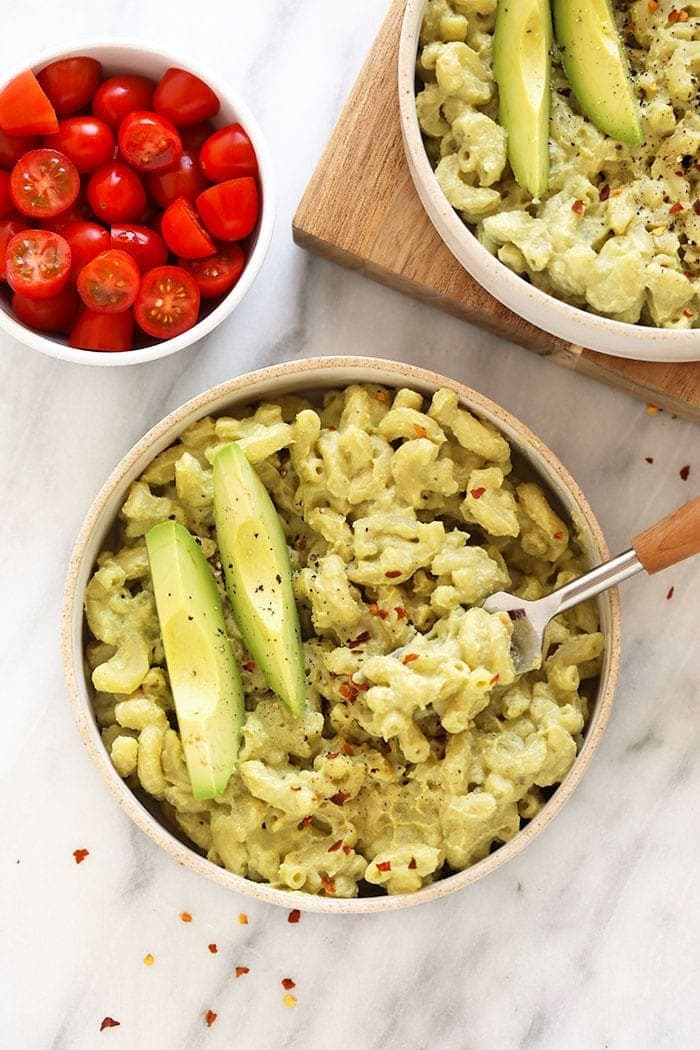 avocado mac and cheese in bowl with fork