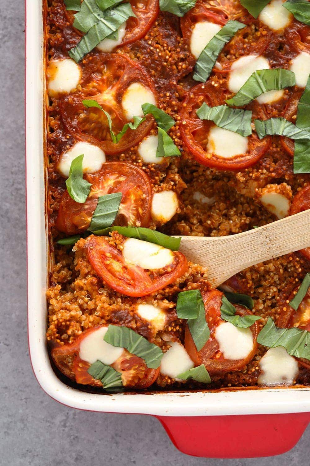 Tuscan chicken quinoa casserole with tomatoes, mozzarella and fresh basil