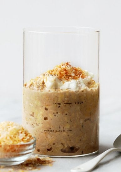 overnight oats topped with whipped cream and granola.