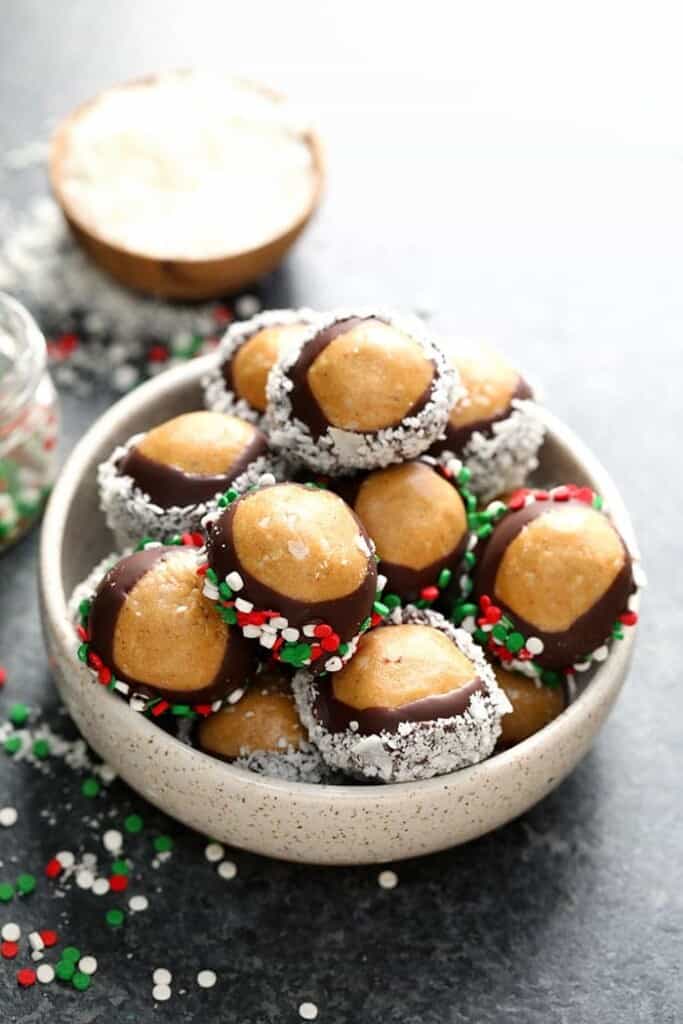 Healthy peanut butter balls in a bowl with sprinkles.