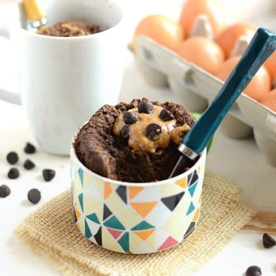 A mug filled with chocolate chips and coconut flour.