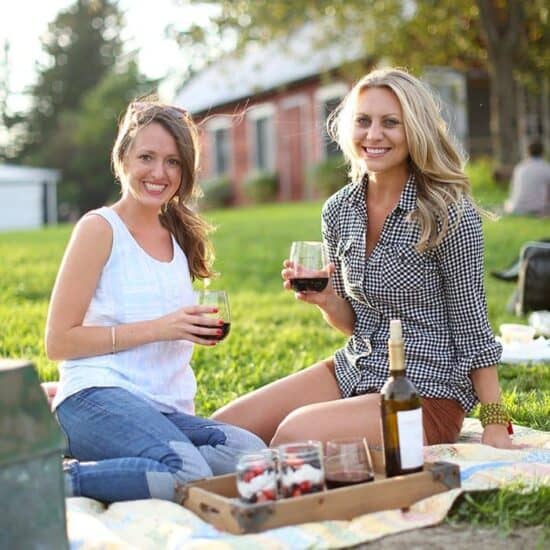 Two women enjoying wine at The Pizza Farm.
