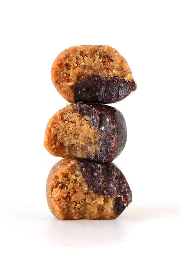 energy balls resembling a stack of cookies with chocolate on top.