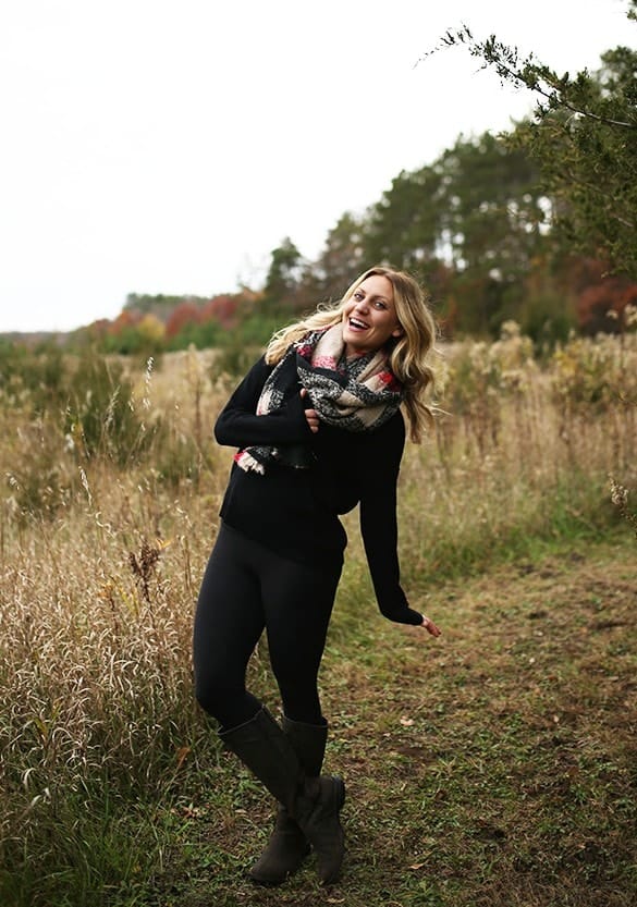 In November 2015, a woman poses in a field while holding a scarf, the result of her Stitch Fix subscription.