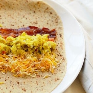 a breakfast burrito with eggs and cheese.