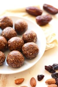 a plate full of cherry pie energy balls.