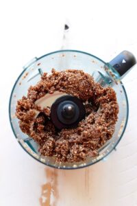 Blend chocolate granola and cherry pie energy balls together in a food processor.