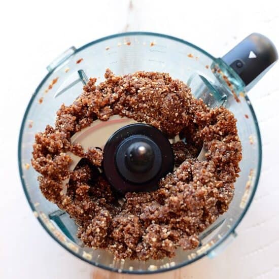 Blend chocolate granola and cherry pie energy balls together in a food processor.