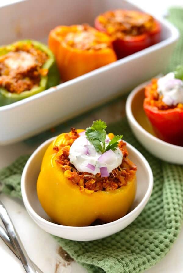 mexican stuffed peppers on plate with more in background