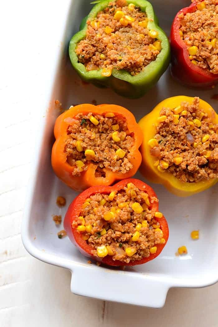 quinoa stuffed mexican stuffed peppers in baking dish