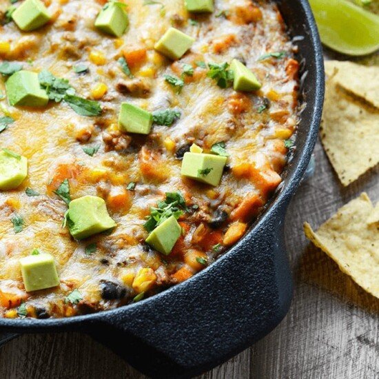 Mexican Enchilada Dip cooked in a cast iron skillet.