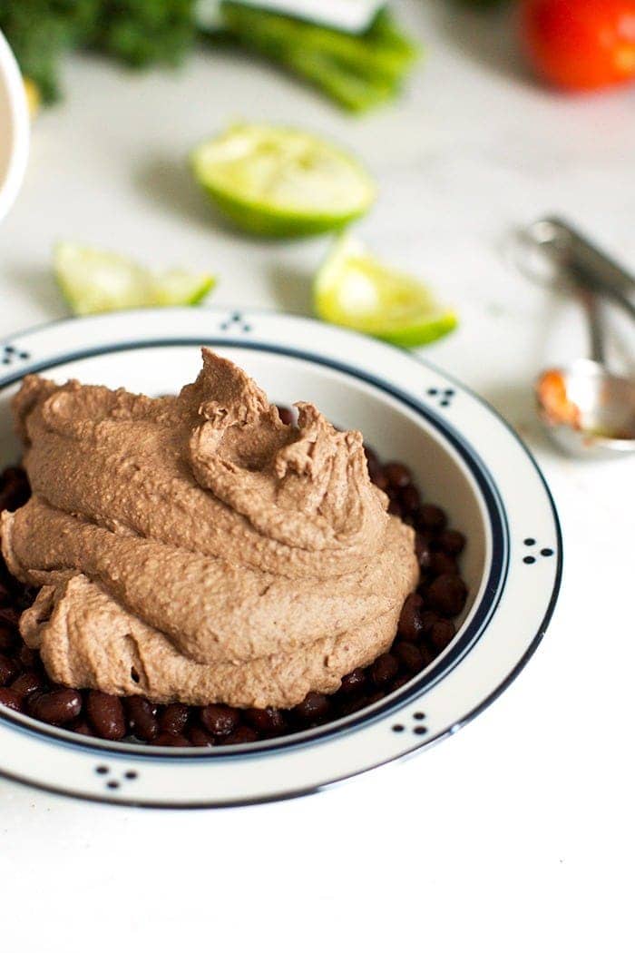 mexican black bean hummus scooped into a bowl