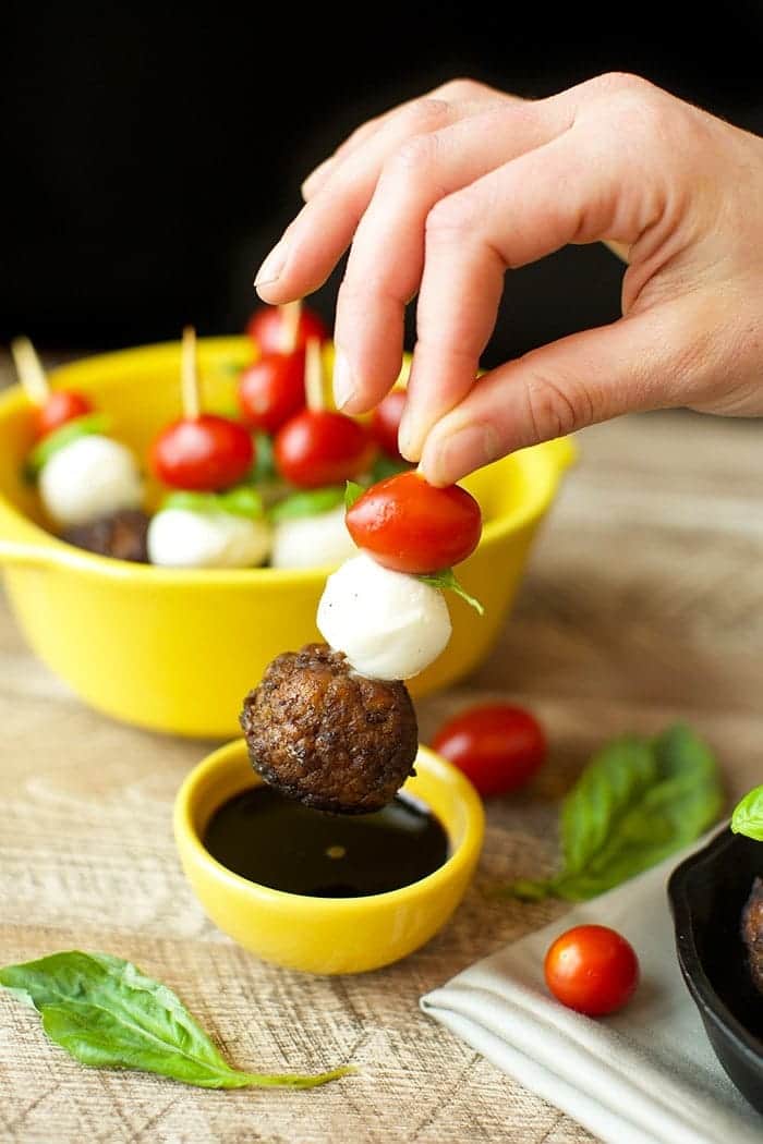 These Caprese Meatball Skewers are the ultimate party appetizer made with balsamic meatballs, fresh mozzarella, basil, and a cherry tomato!