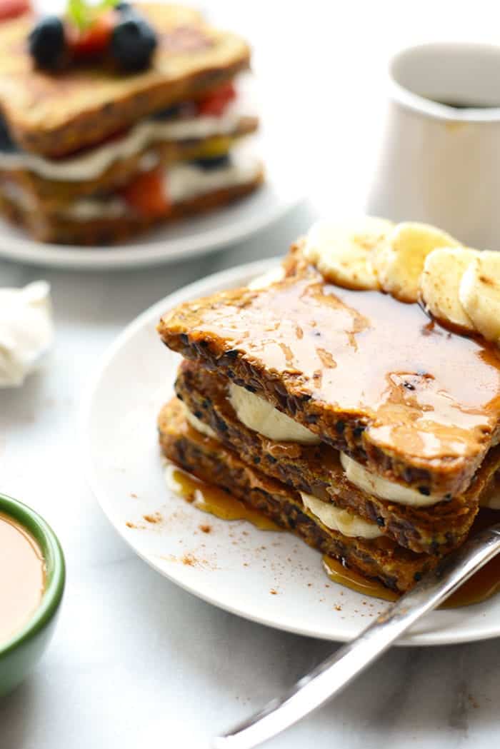 Banana peanut butter stuffed french toast on a plate.