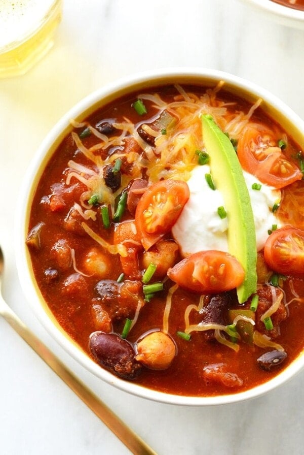 two bowls of vegetarian chili with avocado.