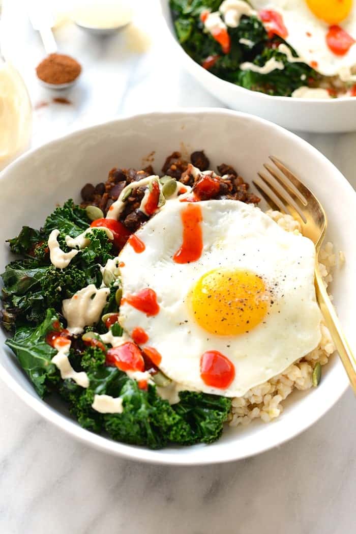 Make your breakfast a savory one and prep these delicious black bean breakfast bowls for the week! They're made with black beans, sautéed kale, brown rice, an egg, and all the fixins! 