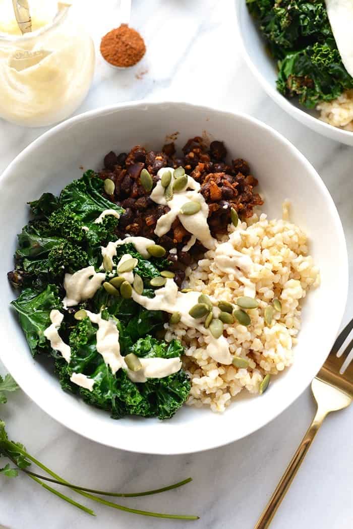 Make your breakfast a savory one and prep these delicious black bean breakfast bowls for the week! They're made with black beans, sautéed kale, brown rice, an egg, and all the fixins! 