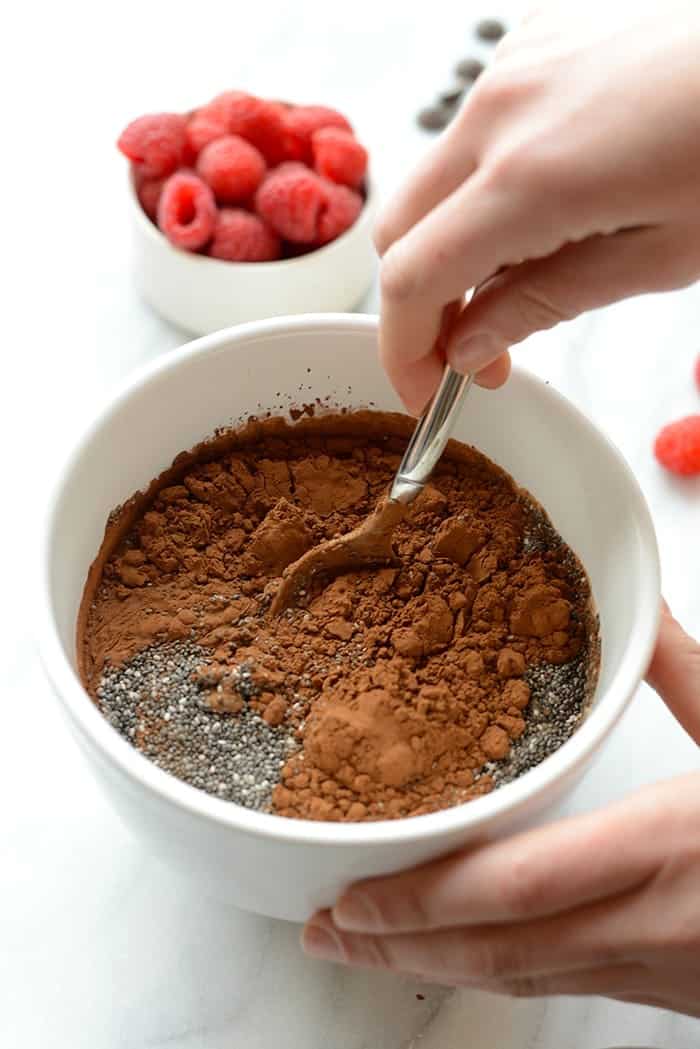 chocolate chia seed pudding ingredients being stirred up