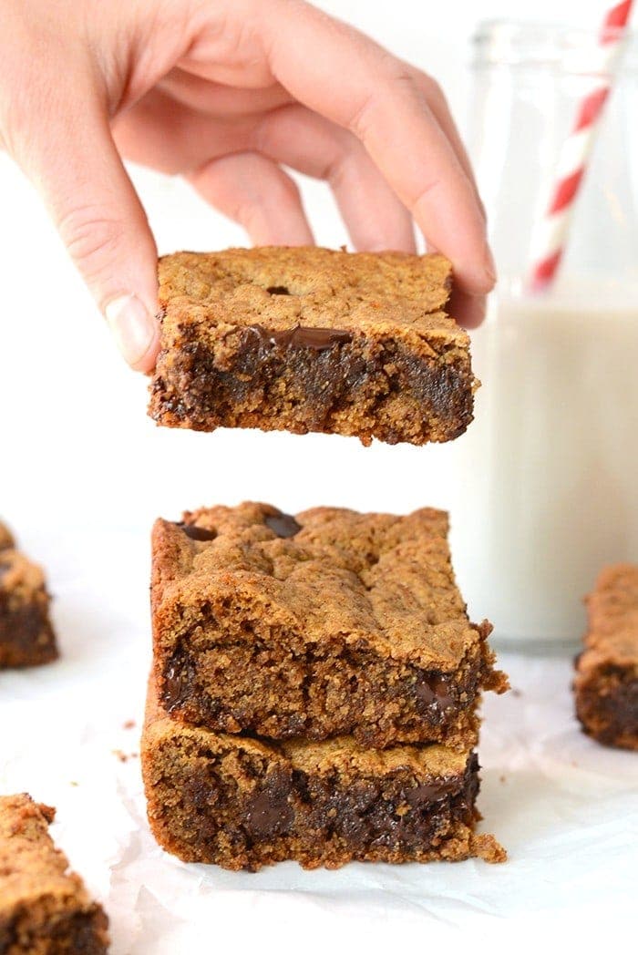 These healthier chocolate chip cookie bars are made with an almond butter base and are paleo-friendly! Did I mention they're epically gooey and irresistible?