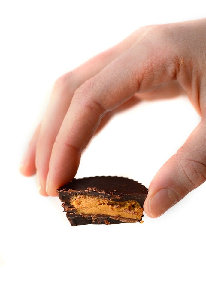 Hand holding a peanut butter cup.