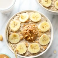 A bowl of overnight oats with peanut butter and banana slices.