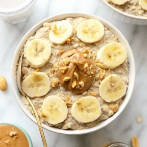 A bowl of overnight oats with peanut butter and banana slices.