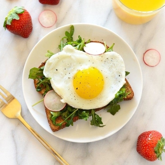 A delightful twist on toast for Toast Tuesday, topped with a sunny-side up egg and fresh radishes.