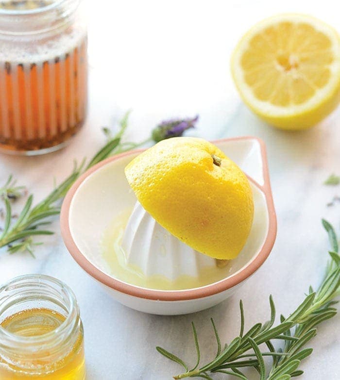 lemon on juicer with honey