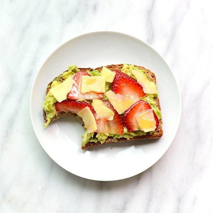 Jazz up your toast with some fresh fruit and cheese for an epic breakfast of Strawberry, Avocado, and White Cheddar Toast!