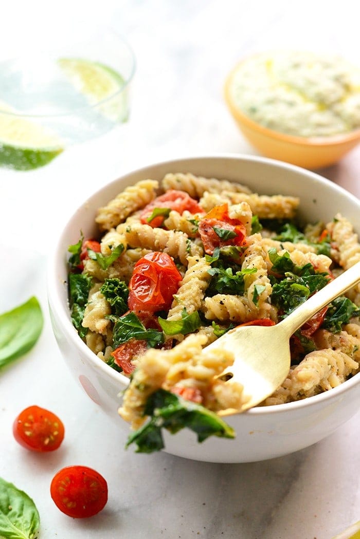 Looking to mix up your pasta dish? Make this delicious Creamy Vegan Pasta with Sautéed Kale, and Tomatoes.