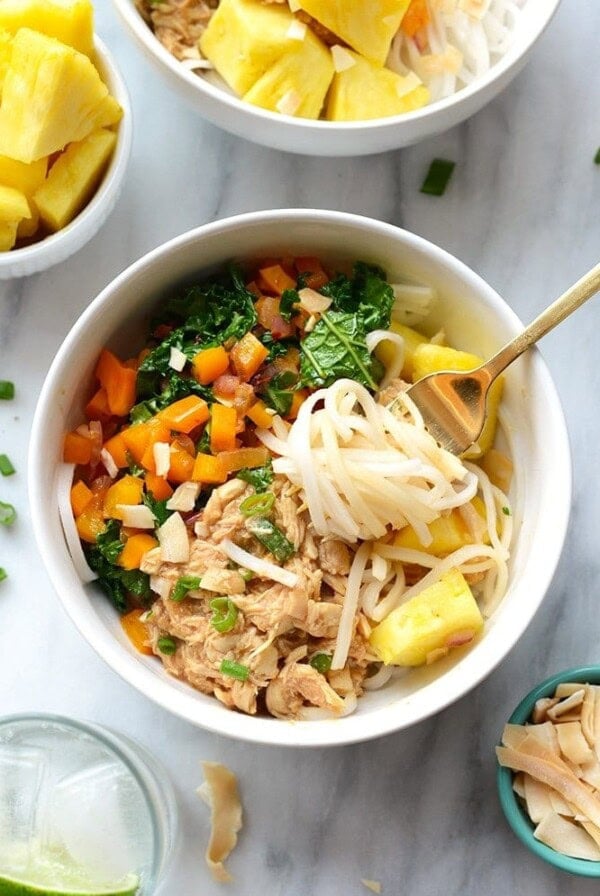 A healthy Hawaiian noodle bowl with pineapple and kale.