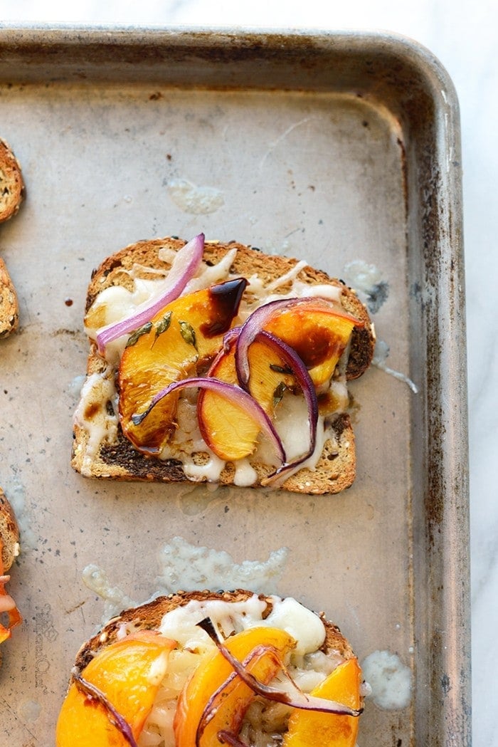 Get fancy with your grilled cheese and add some delicious roasted peaches with gouda cheese and a drizzle of aged balsamic in between some seedy bread!